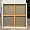 Large wooden frame with four square spaces showing the reverse side of a canvas, with a note indicating that the actual back of the canvas may vary from the standard representation.
