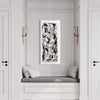 Abstract Landscape Canvas Art | Mystique II 18x40"
A captivating abstract landscape painting with expressive brushstrokes in black, white, and hints of purple, displayed prominently in a stylish white and gray interior setting with a built-in window seat.