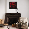 Large abstract painting in red and black on canvas, framed and displayed above a fireplace mantel in a cozy living room setting. The room features a beige armchair, woven baskets, and other decorative elements, creating a warm and inviting atmosphere.