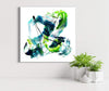 Vibrant abstract square artwork featuring dynamic brushstrokes in earthy tones of green, blue, and black, creating a modern and expressive visual composition.