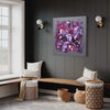 Large abstract painting with vibrant purple and pink tones displayed on the dark gray wall in a modern living room setting. The painting is surrounded by cozy white seating, woven baskets, and decorative accents, creating a warm and inviting atmosphere. The large canvas art piece serves as the focal point, adding a bold and contemporary touch to the space.