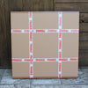 Large cardboard boxes wrapped in fragile tape, ready for shipping or storage