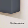 Edge of a painting on a wall with text 'Edge of the painting'.