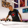 Large abstract artwork | Vibrant expressive painting | Man in black Converse shirt creating art