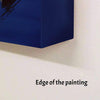 Large blue abstract painting on white wall