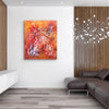 Vibrant abstract canvas art | Fiery orange and red tones in modern artwork | Large abstract painting displayed on contemporary living room wall | Striking artistic composition with dynamic brush strokes | Original canvas art by Paresh Nrshinga