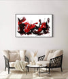 Expressive abstract landscape art with bold red and black brushstrokes displayed on living room wall