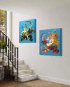 Vibrant abstract artwork on display in a modern home interior, featuring large canvas paintings with bold, colorful patterns and compositions. The artworks are framed and hung on the white walls, adding a dynamic and eye-catching visual element to the staircase area.