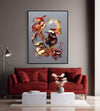 Large abstract canvas painting of dynamic, colorful shapes in warm hues of orange, red, and gold, displayed above a plush red sofa in a modern living room setting.
