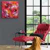 Vibrant Abstract Art | Colorful Floral Painting on Wall
This image showcases a large, vibrant abstract painting featuring a bold floral design in shades of red, orange, and yellow. The painting is displayed on a gray wall, complementing the modern and minimalist interior design elements, including a red tufted armchair and side tables. The floor-to-ceiling windows provide a scenic view of the lush outdoor greenery, creating a serene and inviting atmosphere.