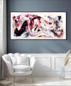 Extra Large Canvas Painting | Snowflake Waltz 30x60"
Vibrant abstract artwork with swirling colors and dynamic movement, displayed on a grey wall in a minimalist living room setting with a white armchair.