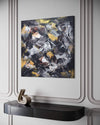 Square Abstract Painting | Golden Snowflakes 100x100cm - Earthy color art featuring a modern abstract design with splashes of yellow, black, and brown on a large canvas.