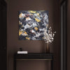 Square abstract painting with golden snowflakes | Large contemporary artwork in a moody dark interior setting with a modern furniture piece and floral decor