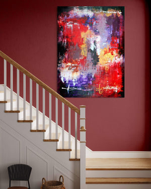 Vibrant abstract artwork titled "Forgotten World" displayed on a wall along a staircase. The painting features a mix of bold, colorful brush strokes in red, purple, and blue hues, creating a dynamic and expressive modern art piece.