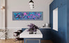 Original abstract landscape painting on large canvas in modern home interior with blue kitchen cabinets, floral arrangement, and decorative lighting.