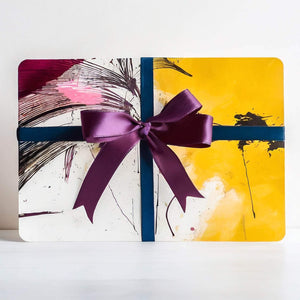 Vibrant abstract gift card with colorful brushstrokes, featuring a purple ribbon bow.