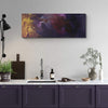 Vivid Abstract Art | Dusk Till Dawn I 18x48" - Large abstract landscape painting in vibrant purple, gold, and red hues hanging on the wall above a wooden cabinet with kitchen decor.