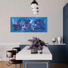 Vibrant abstract blue and purple canvas painting hanging on the wall of a modern dining room with sleek black furniture and decor.