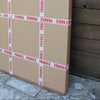 Cardboard boxes marked with the word "Fragile" in bold red letters on a wooden surface.