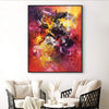 Vibrant abstract painting with bold brushstrokes of red, orange, and purple hues, adding dynamic energy to the modern living room setting.
