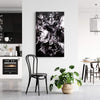 Large monochrome abstract painting with fluid, dynamic movement displayed on white wall in modern kitchen and dining room setting.