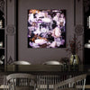 Large Abstract Art | Chasing the Moon
A vibrant, modern abstract canvas art piece hanging on a dark gray wall, surrounded by vintage decor elements like ornate moldings and a wooden dining table with chairs.