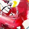 Large abstract painting with vibrant red, yellow, and black brush strokes on canvas