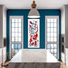 Vibrant abstract artwork on a large canvas hangs between two white-framed windows in a modern dining room with a marble table and wooden accents.