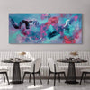 Vibrant abstract painting with a dreamcatcher motif on a large canvas displayed above a modern dining table setting.