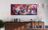 Vibrant abstract landscape painting on canvas in living room decor. Colorful, earthy tones and dynamic brushstrokes create an eye-catching modern art piece above wooden sideboard. Minimal, contemporary furniture and lighting complete the stylish interior design.