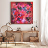 Vibrant abstract painting "Dancing Hues II" with bold brushstrokes and vivid colors, showcased in a rustic, minimalist interior setting.