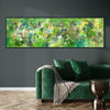 Green Artwork | Emerald Symphony 24x80"
This large abstract landscape painting features a vibrant and expressive blend of greens, creating a captivating and serene atmosphere. The artwork is displayed prominently on the wall, complementing the cozy green sofa and modern decor in the room.
