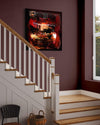 Vibrant abstract art on display in a cozy home stairwell, featuring bold red, orange, and black brushstrokes on a canvas. Wooden staircase with white railings and a woven basket at the base complete the charming interior scene.