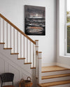 Abstract landscape artwork | Island In The Shadows II 100x130cm - Large abstract painting featuring geometric shapes and muted tones, displayed on a staircase in a modern home setting.