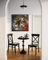 Contemporary Abstract Art | Into The Light 40x40"
Vibrant abstract painting featuring bold colors and dynamic brushstrokes, displayed in a modern home setting with dark wooden chairs and a decorative table.