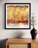 "Earthy Dream" Signed Edition Art Print - Abstract landscape painting with warm, earthy tones displayed in a black frame on a wall above a wooden cabinet with a decorative vase.