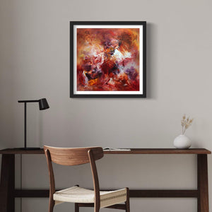 Colorful abstract art print titled "Little Secrets" displayed on a wall above a wooden desk and chair in a modern home office setting.
