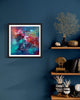"Vibrant Abstract Art Print" - Captivating abstract artwork in vibrant colors displayed on the wall, complemented by natural decor elements such as dried coral and vases on a wooden shelf.