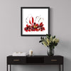 "Wedding Bells" Signed Edition Abstract Art Print - Vibrant Red and Black Artwork Displayed on Wall with Decorative Floral Arrangement