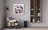 Large abstract painting with bold strokes and colors on wall, modern wooden chair, and minimalist book shelves in contemporary home interior