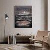 Abstract landscape | Island In The Shadows II 100x130cm - Original abstract art painting featuring a serene island landscape with a moody, atmospheric sky against a dark backdrop, displayed in a modern room setting with a wood and wicker chair.