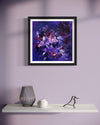 Vibrant abstract art print titled "Dreams of Revelation" displayed in a modern home setting with minimal decor, including a vase and a decorative bird figurine on a white shelf against a light purple wall.