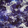 Abstract art with blue and white brush strokes on a dark background