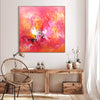 Vibrant abstract painting | Fiery red and orange tones with splashes of white | Large canvas artwork on display in cozy living space | Rustic wooden furniture and accents complement the bold artwork