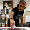 Mature man in headphones working on abstract artwork