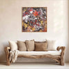 Large abstract painting with earthy colors and textures on wall above rustic wood-framed sofa with beige pillows and throw.