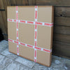 Blue Abstract Painting | Quiet Flame II - Stacked cardboard boxes with "Fragile" warning labels, surrounded by a wooden background.