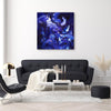 Large abstract blue canvas painting titled "Skyfall" displayed on the wall of a modern living room with a black sofa, coffee table, and accent chairs.