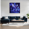 Vibrant Blue Canvas Painting | Skyfall 100x100cm - Captivating abstract art with swirling, dynamic blue tones creates a striking focal point in this modern living room setting.