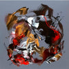 Colorful abstract brush strokes and dripping paint create a vibrant, energetic circular composition. The painting features a dynamic blend of warm amber, fiery red, and dark contrasting shades, conveying a sense of motion and expressive gestural movement. This bold, modern abstract artwork would make an impactful visual statement in any home or office space.